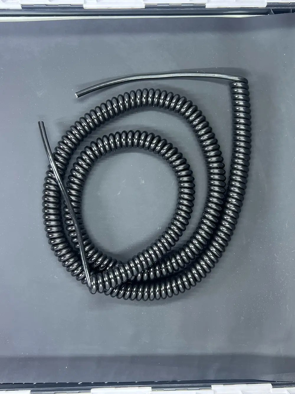 Close-up of Autac USA manufactured retractile cord products